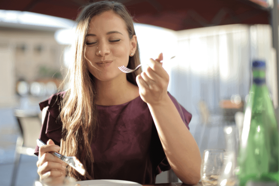 woman eating with fork and knife