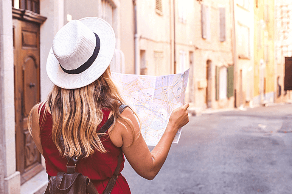 woman reading map in old town