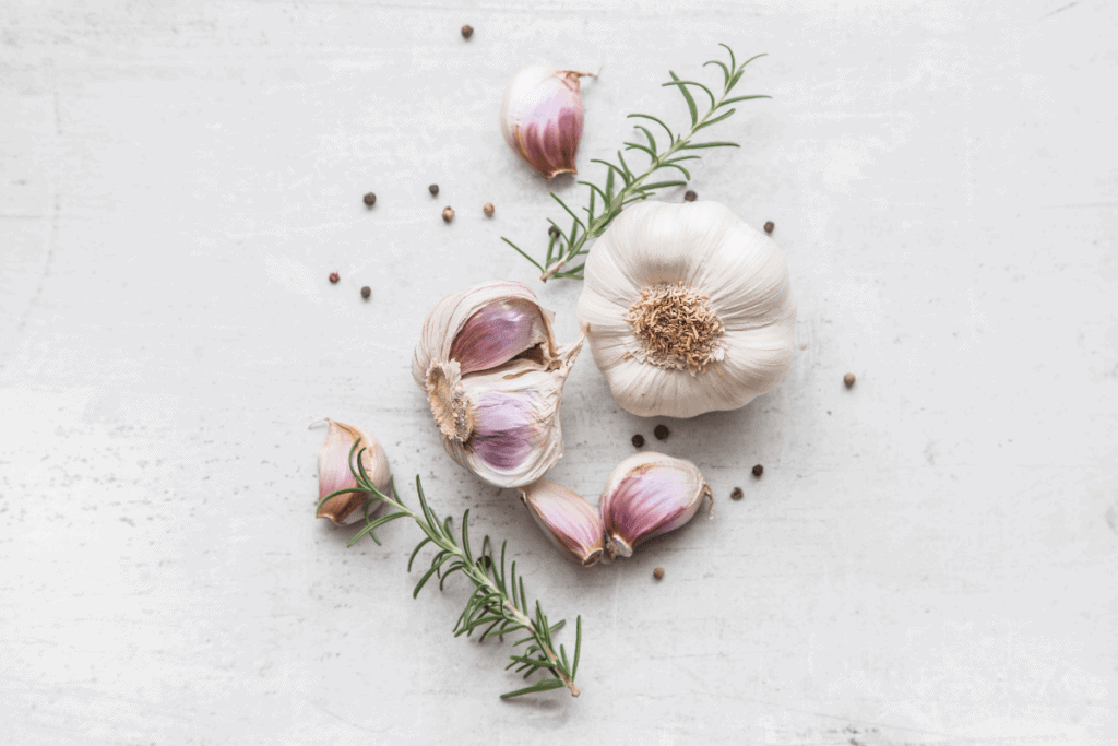 Garlic cloves and rosemary sprigs